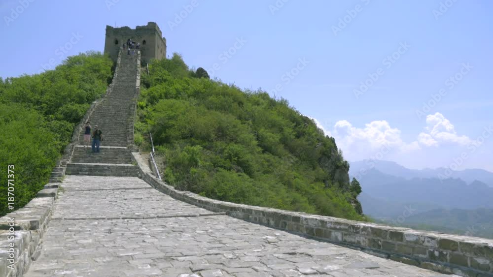 Pan up to one of The Great Wall towers under blue sky Pan up to one of The Great Wall towers under blue sky
