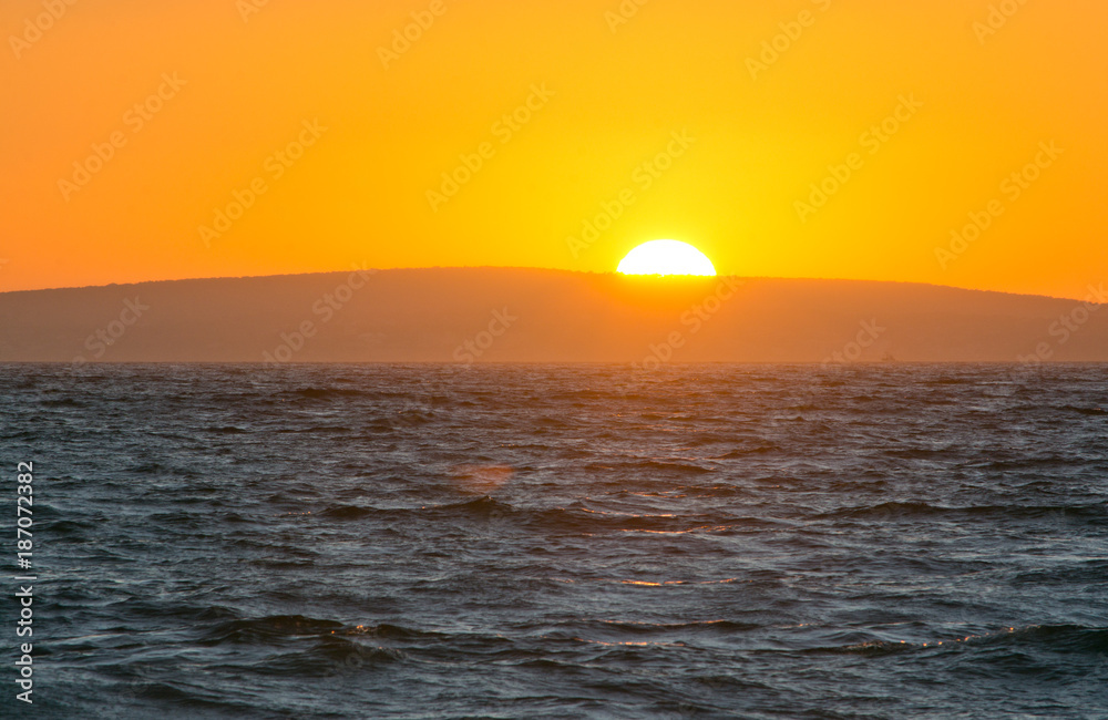 Golden sunset and ocean horizon