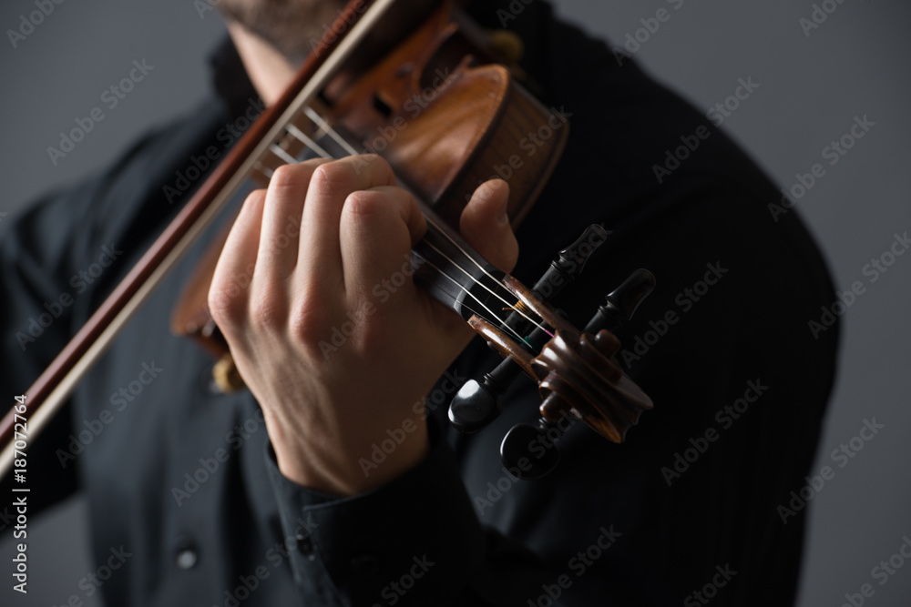 Musician man playing the violin. Musical instrument on performer hands. Classic music concept. Musician man playing the violin. Musical instrument on performer hands. Classic music concept.