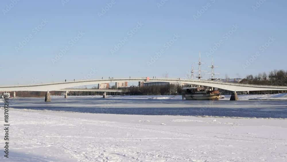 Pedestrian bridge across the Volhov river in Velikiy Novgorod, Russia in cold winter Pedestrian bridge across the Volhov river in Velikiy Novgorod, Russia in cold winter