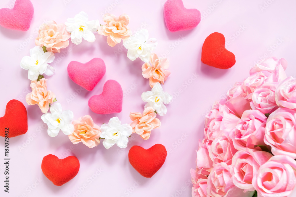 Top view of flat lay decoration Romantic, St valentine's day concept with valentines mini pin heart with pink rose flower on pink background with copy space minimal style. Top view of flat lay decoration Romantic, St valentine's day concept with valentines mini pin heart with pink rose flower on pink background with copy space minimal style.