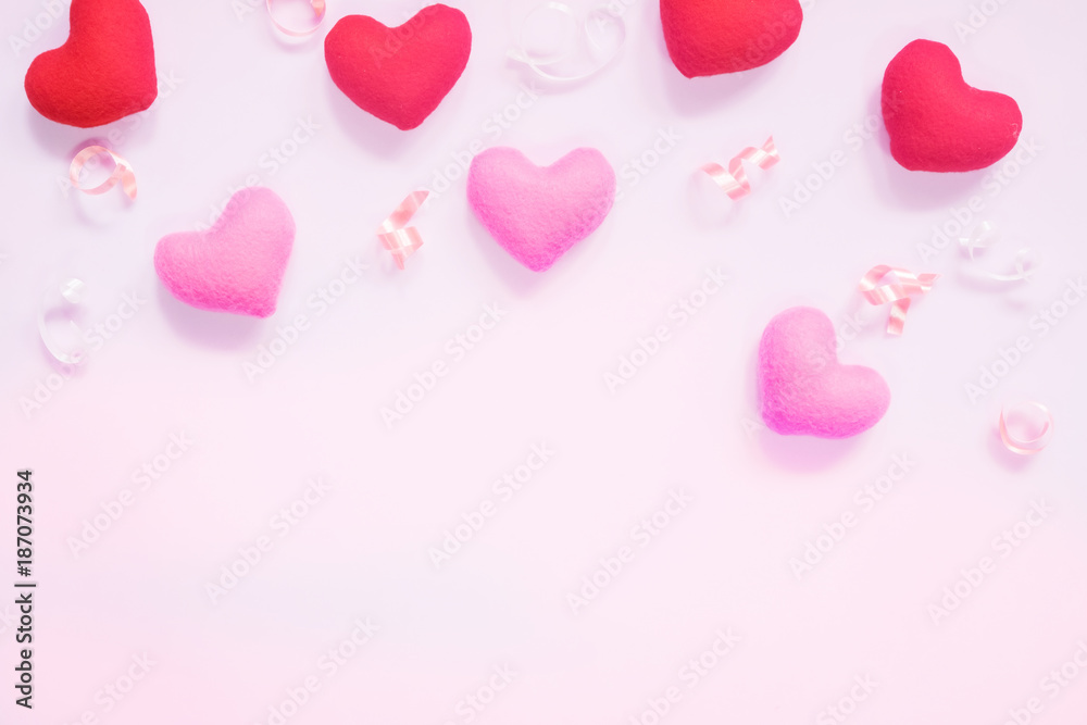 Top view of flat lay mockup with romantic decoration Romantic, St valentine's day concept with valentines mini pin heart on pink background with copy space minimal style.