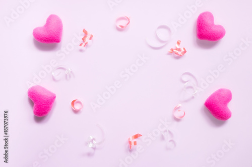 Top view of flat lay mockup with romantic decoration Romantic, St valentine's day concept with valentines mini pin heart on pink background with copy space minimal style.