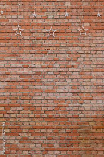 A red brick wall and star's lamp ornament