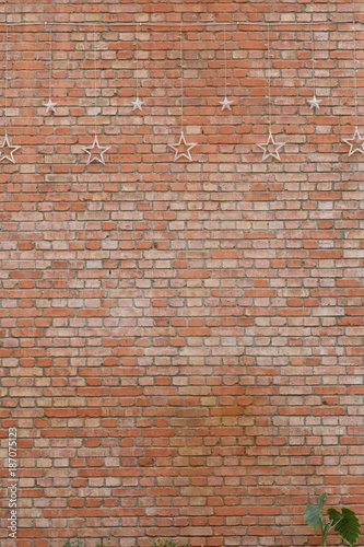 A red brick wall and star's lamp ornament