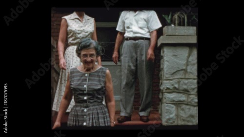 R4_22 Family selling house show off For Sale sign