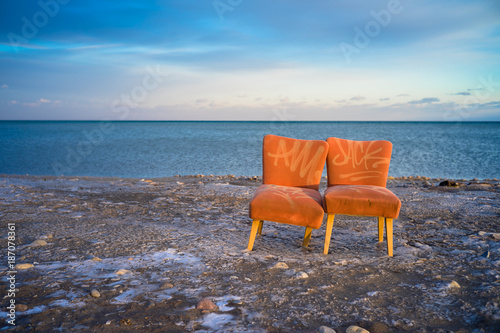 Broken chairs on beach