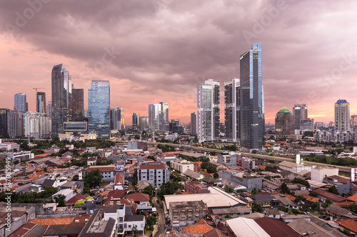 Stunning susnset over Jakarta business district in Indonesia capital city photo