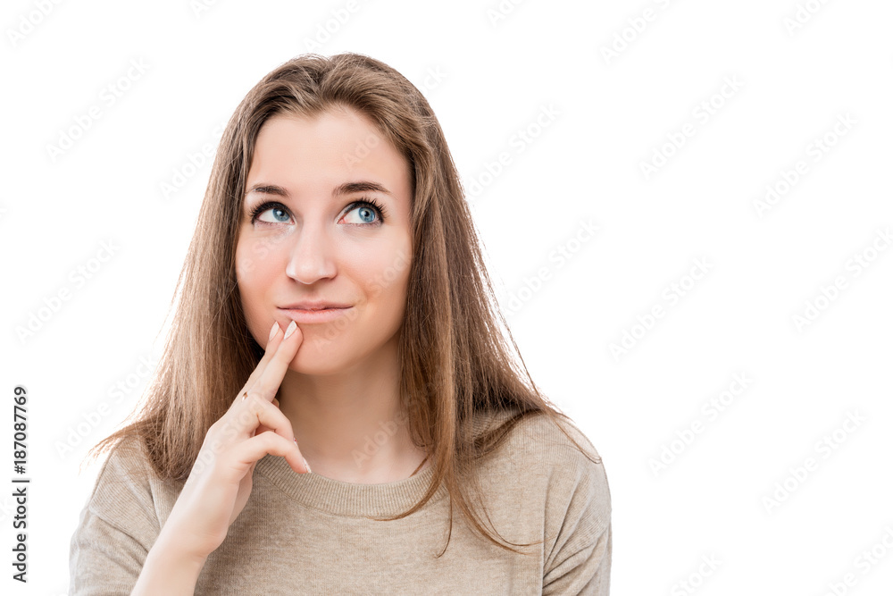 portrait of a pensive dreamy girl on a white background portrait of a pensive dreamy girl on a white background