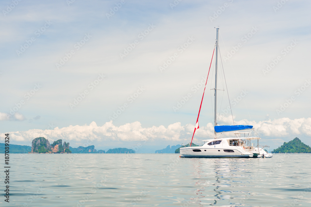 Naklejka premium horizontal toned photo - white yacht in the bay of the Andaman Sea, Thailand