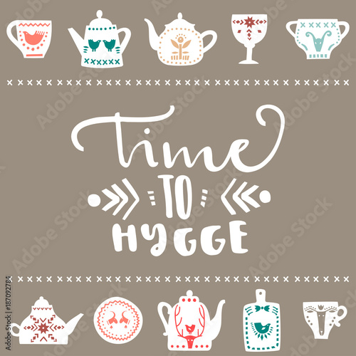Vector poster with handwritten lettering  Time to Hygge  and stylish white teapots and mugs with folk colored patterns on a gray background.