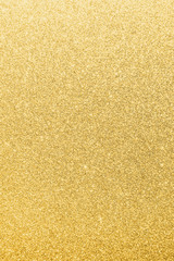 Gold glitter texture background of brilliant yellow metallic golden Christmas holiday decoration backdrop design element