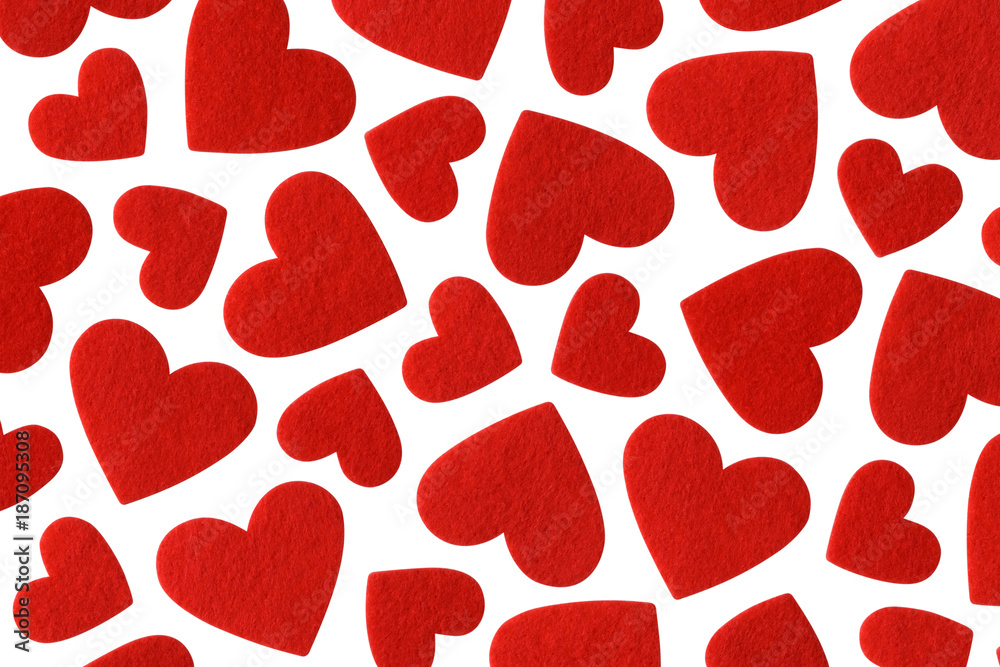 Red felt hearts of different sizes isolated on white background. Valentines day pattern. Red felt hearts of different sizes isolated on white background. Valentines day pattern.