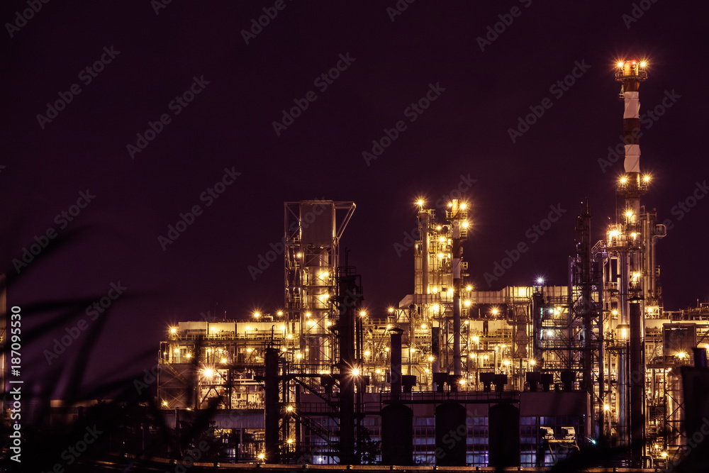an oil plant view with lights at night