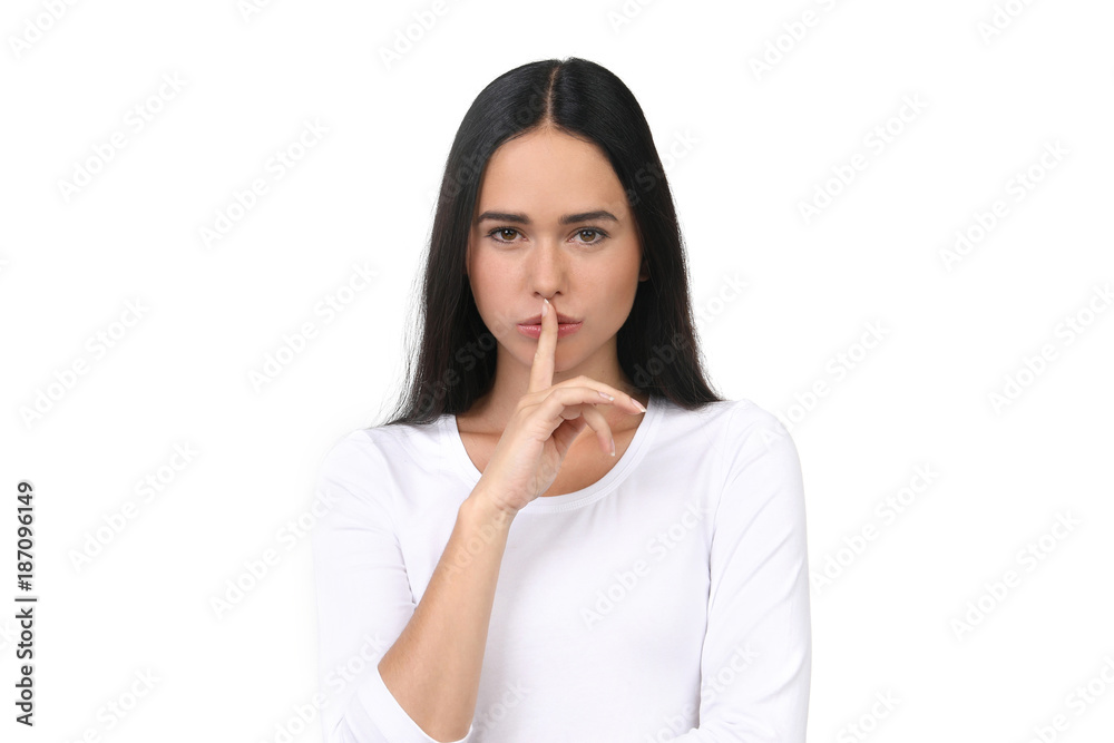 Hübsche Frau mit Finger auf den Lippen Hübsche Frau mit Finger auf den Lippen