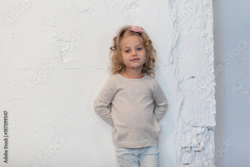 A nice little girl in a gray blank sweatshirt. Mock up. photo