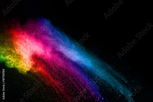 abstract colored dust explosion on a black background.abstract powder splatted background,Freeze motion of color powder exploding/throwing color powder, multicolored glitter texture.