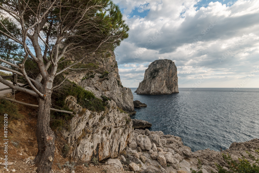 View of Capri (Campania, Italy) typical Faraglioni (sea stacks) View of Capri (Campania, Italy) typical Faraglioni (sea stacks)