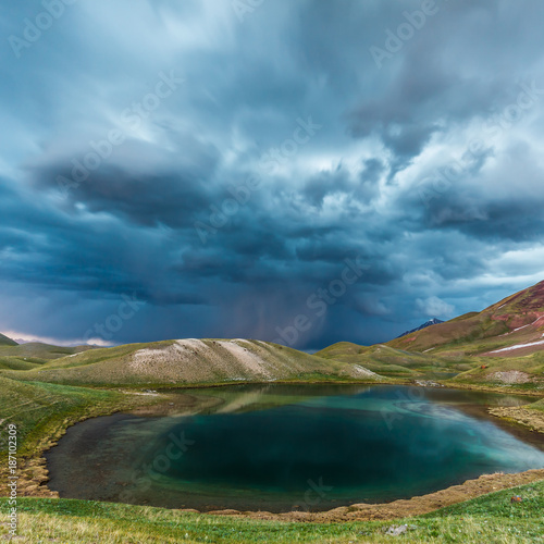 View of Tulpar Kul lake in Kyrgyzstan during the storm © masar1920