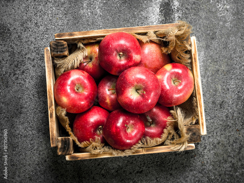 box with ripe red apples.
