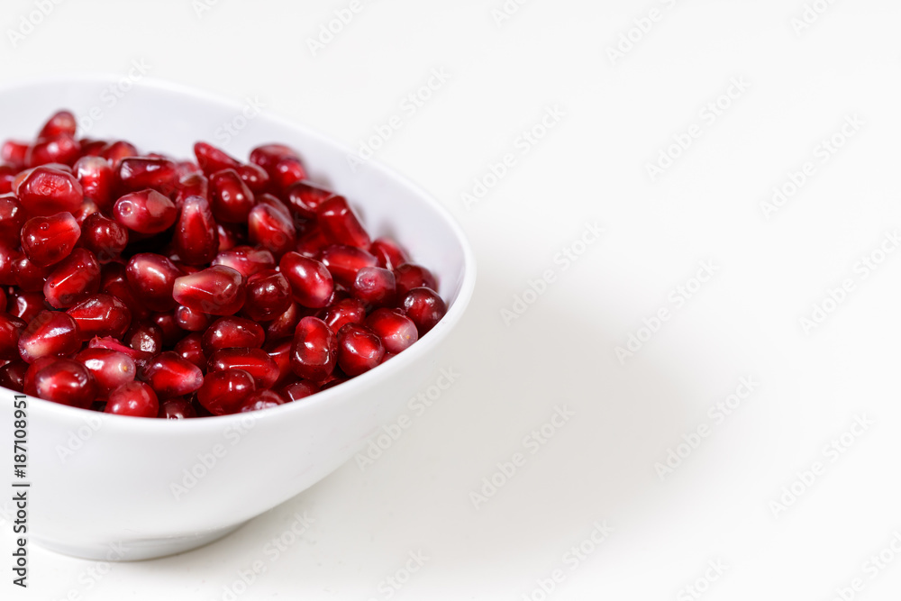 Pomegranate seeds close up on white background Pomegranate seeds close up on white background