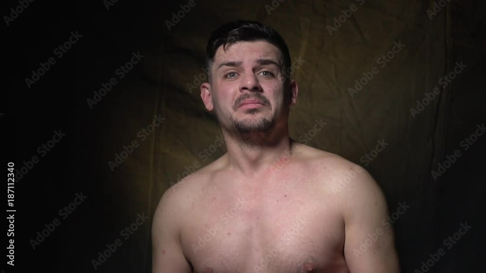 The bearded man shudders and shows that he is scared, slow motion The bearded man shudders and shows that he is scared, slow motion