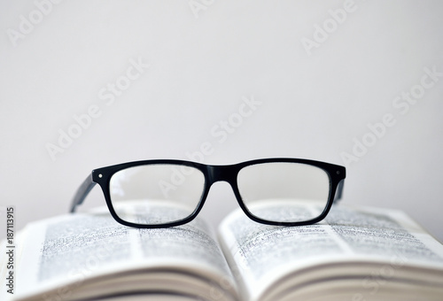 Eyeglasses on a translation book