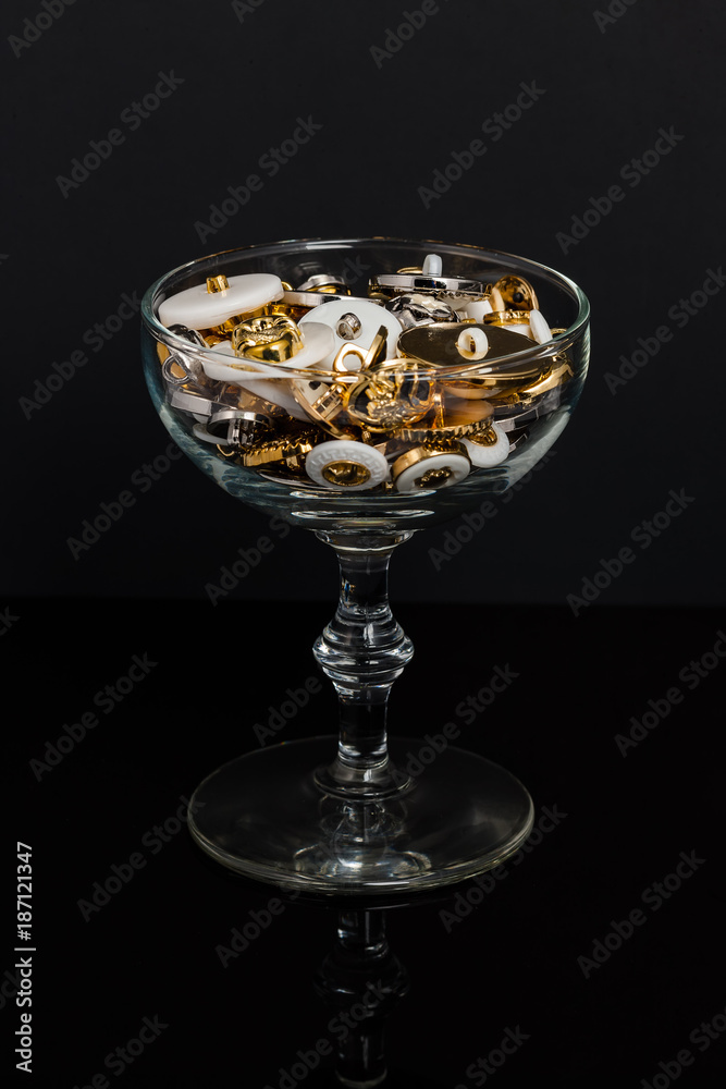 glass of gold white or silver buttons glass of gold white or silver buttons