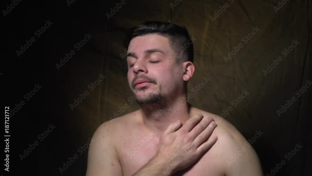 Tired man rubs his face and shows how he wants to sleep Tired man rubs his face and shows how he wants to sleep