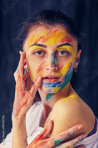 beautiful woman painted with many vivid colors.