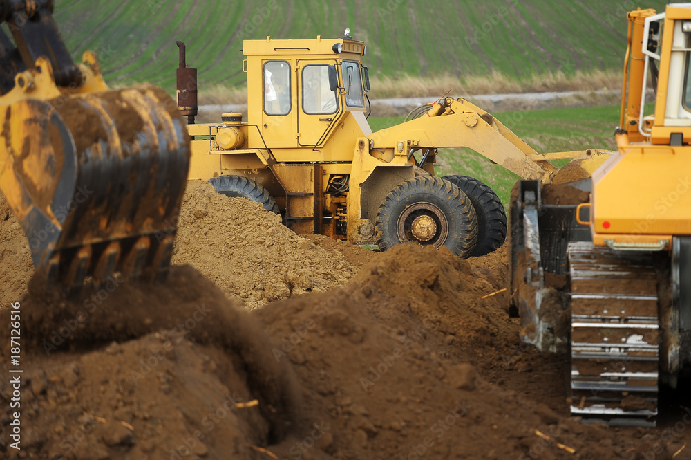 Bulldozer and excavator 