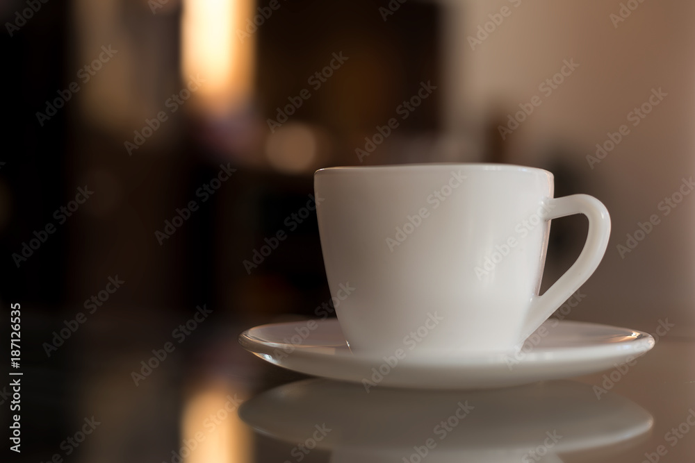 Coffee in a white cup on the table. Coffee in a white cup on the table.