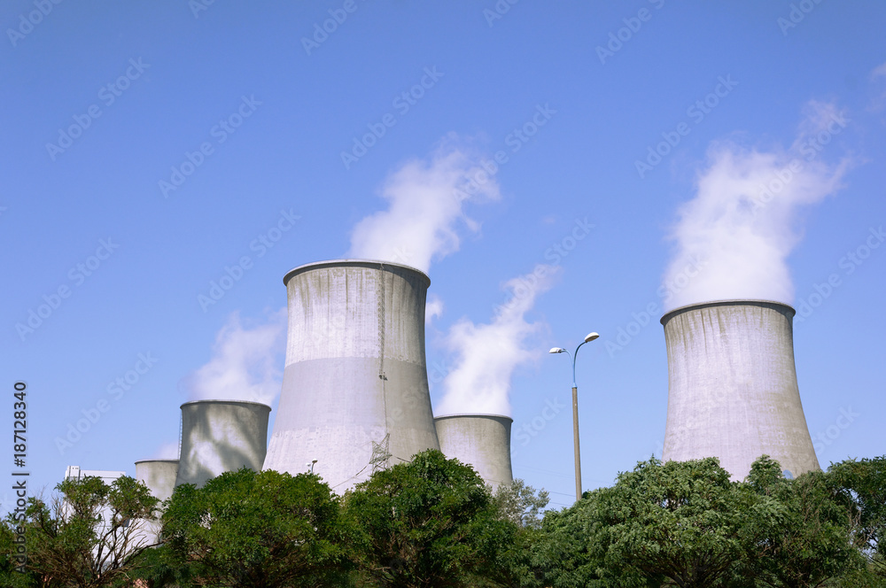 Big chimneys against the blue sky.