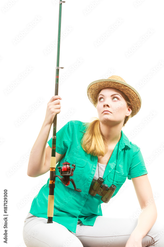 Bored woman with fishing rod, spinning equipment Bored woman with fishing rod, spinning equipment
