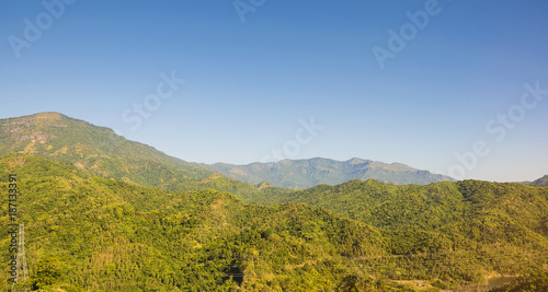 beautiful green mountains/Hills with blue sky background. Winter landscape season in asia Thailand. © sky1991