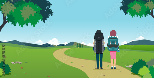 Male and female travelers have a backpack with a mountain backdrop.