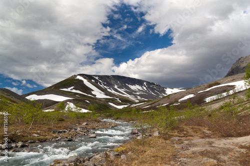 mountain stream in the Khibiny mountains in the north of Russia photo