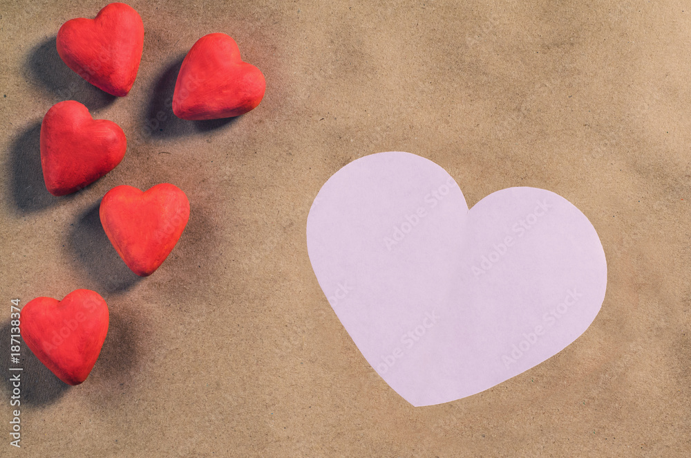 Red hearts on a brown paper background. Valentine's day Red hearts on a brown paper background. Valentine's day