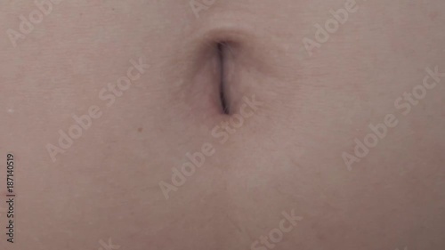 Female Navel Moving at Laughing. Extreme Close Up