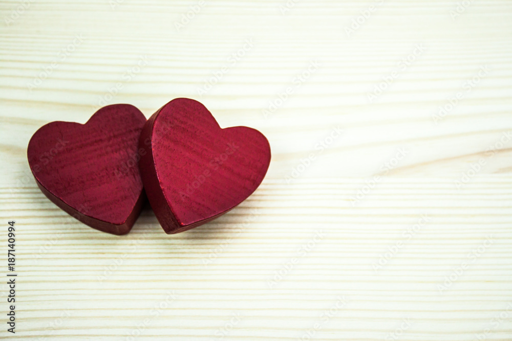 Two hearts on a wooden background Two hearts on a wooden background