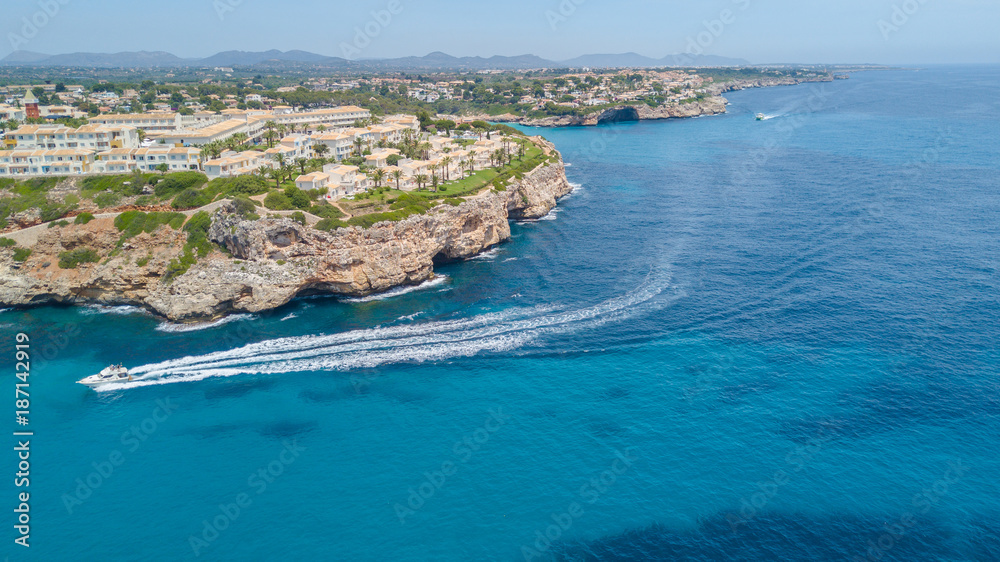 Drone aerial landscape of the beautiful bay of Cala Estany d'en Mas with a wonderful turquoise sea, Cala Romantica, Porto Cristo, Majorca, Spain