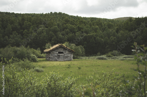 Old wooden house and farm buildings