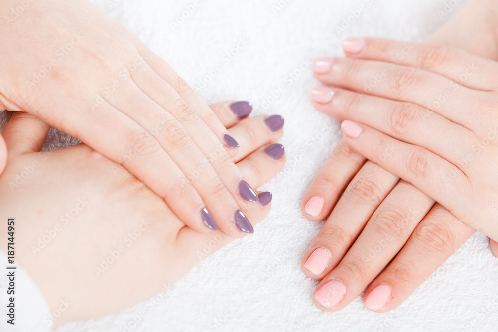 Woman presenting her beautiful painted gel hybrid nails Woman presenting her beautiful painted gel hybrid nails