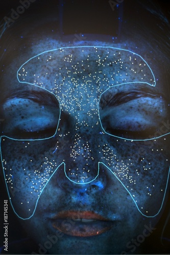 Image of young woman's face in skin clinic