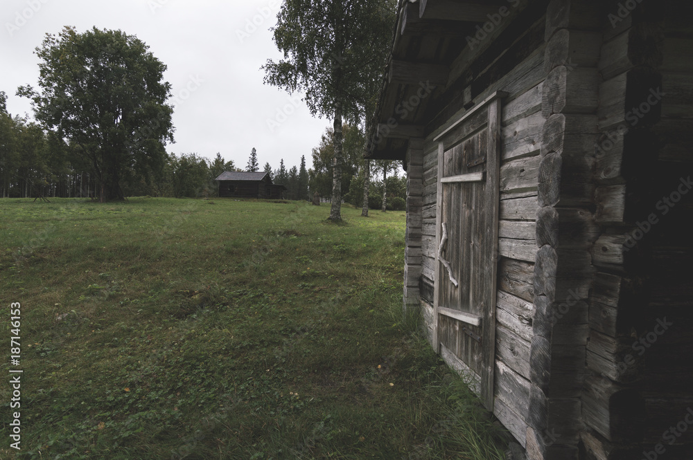 Old wooden house and farm buildings Old wooden house and farm buildings