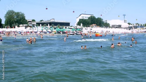 Crowded Beach At The Black Sea Resort, People Having Fun In The Water, Pan