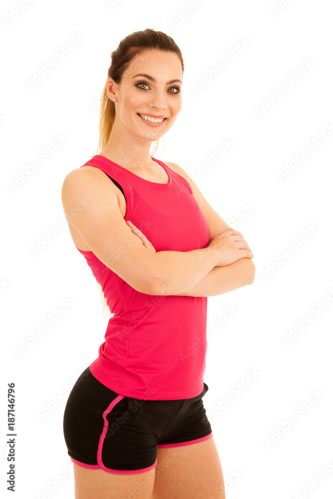 Beautiful sporty woman standing with crossed arms isolated over white background