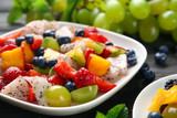 Plate with delicious fruit salad, closeup