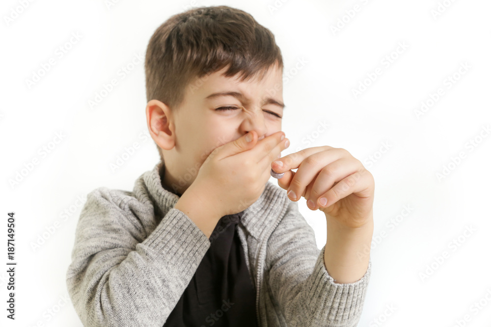 Young boy doesn't want to take a medicine Young boy doesn't want to take a medicine