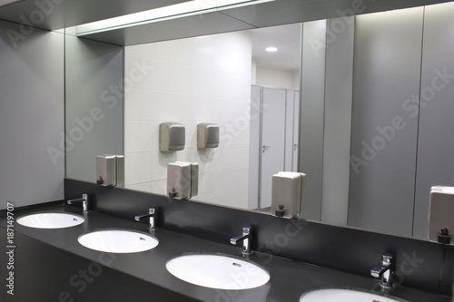 Tela Modern sinks with mirror in public toilet